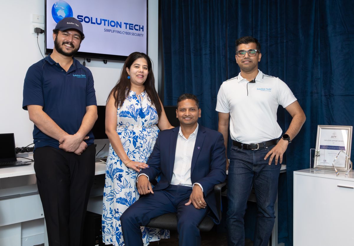 Group photo of Solution Tech team in the Solution tech office
