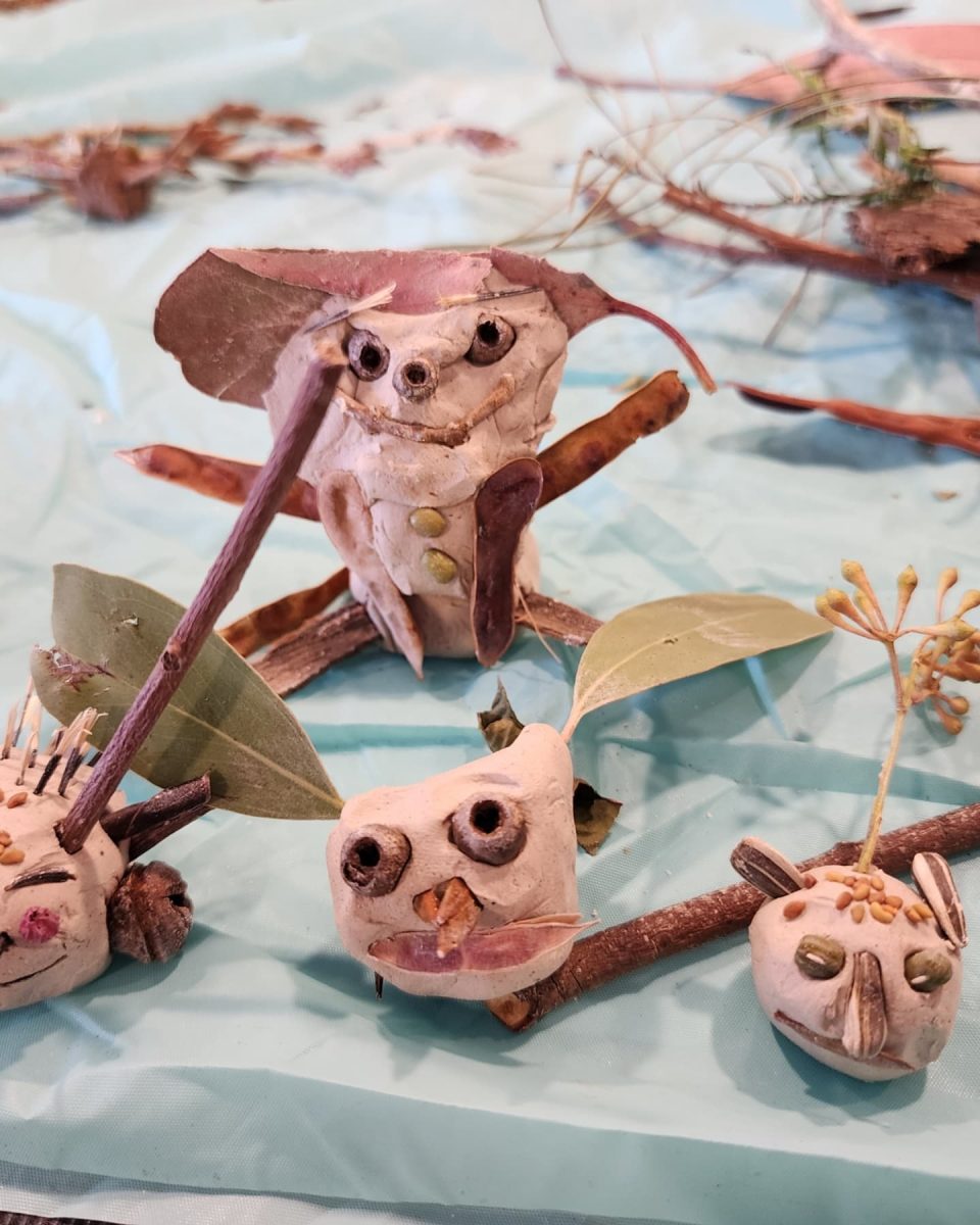 Little creatures made of clay, decorated with seeds and leaves.