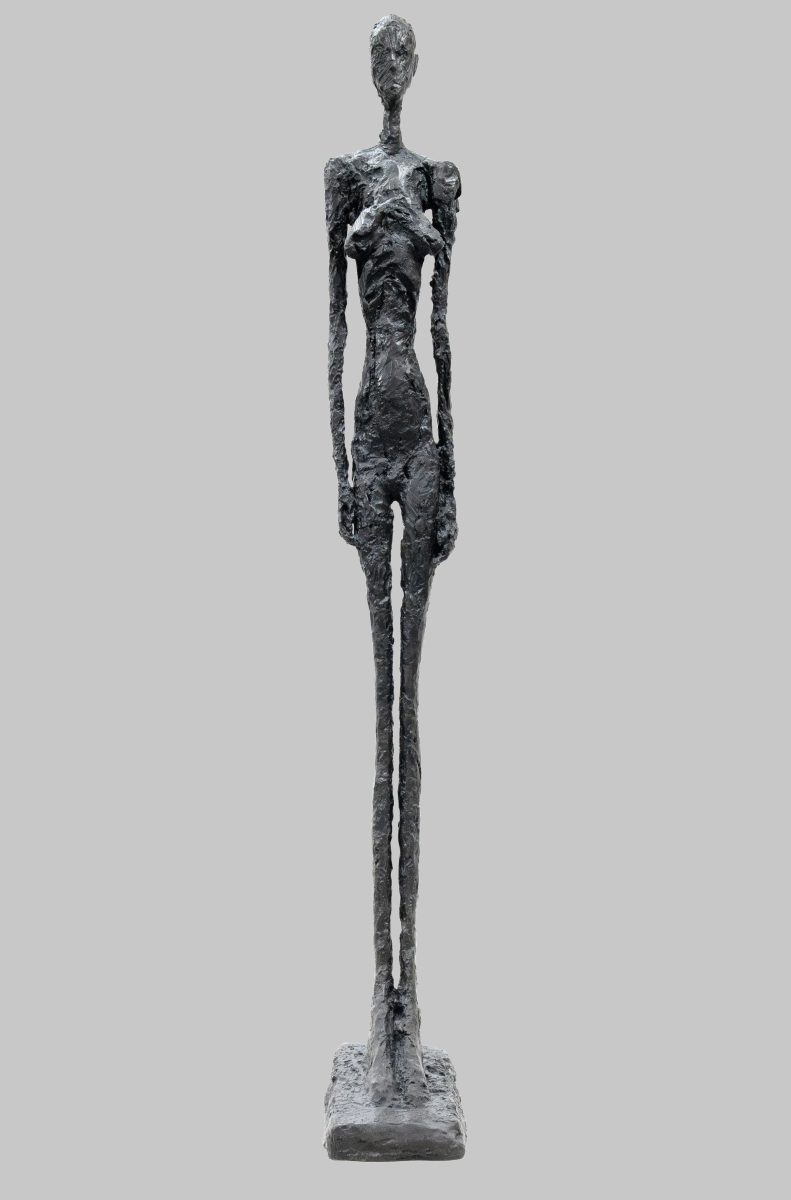 A sculpture of a very elongated figure