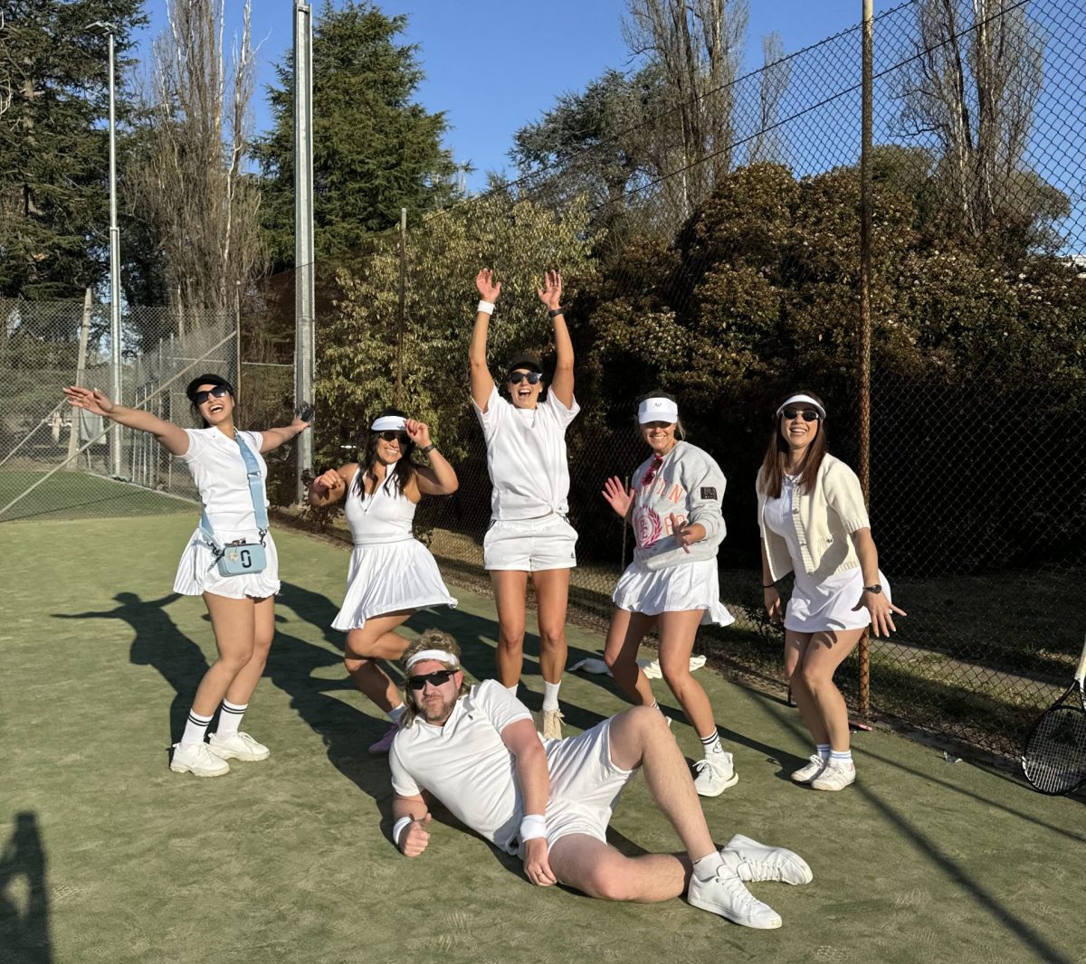 group of tennis players posing in celebration