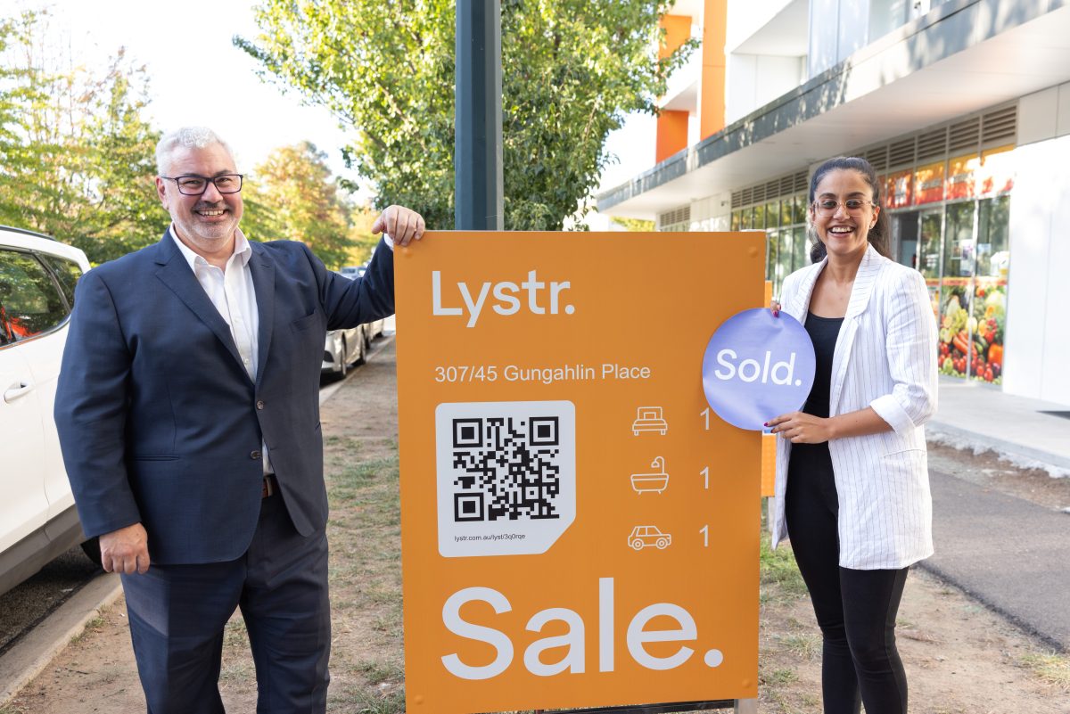 Chris Scullin with Dinah holding a Lystr sold sign