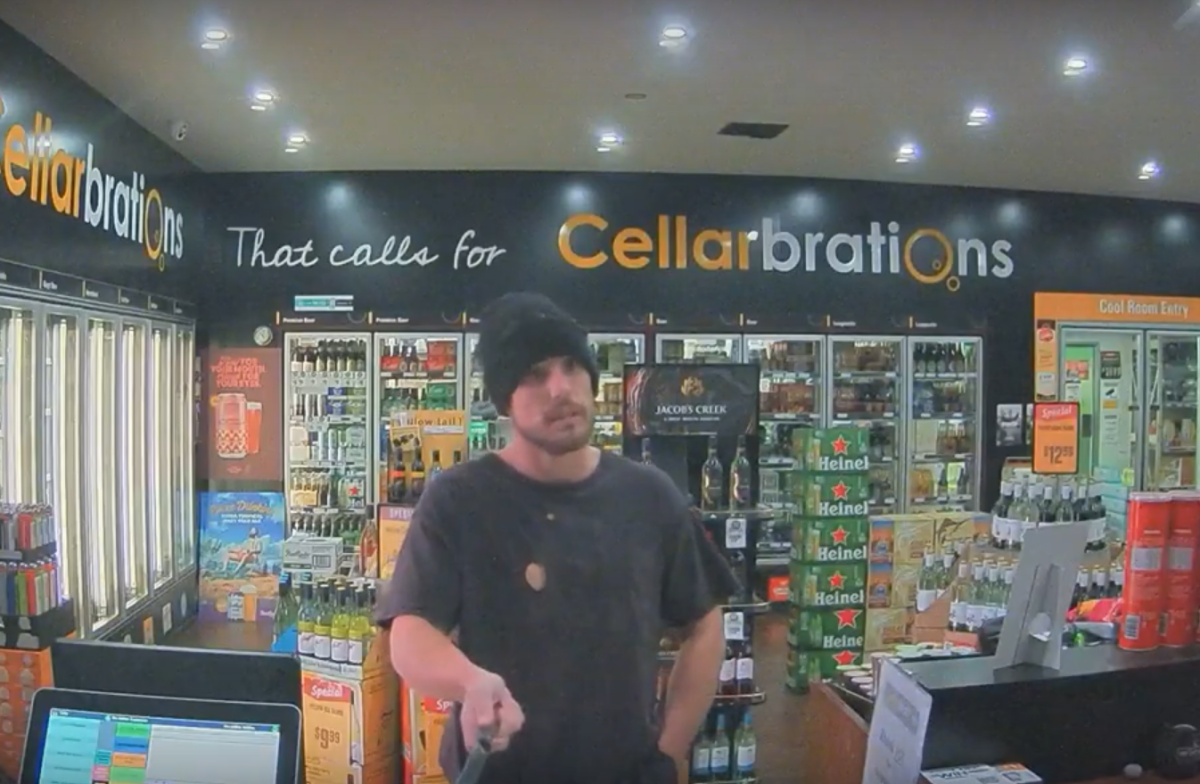 Police say a man was filmed robbing a liquor store in Gungahlin on 26 May. Photo: ACT Policing.