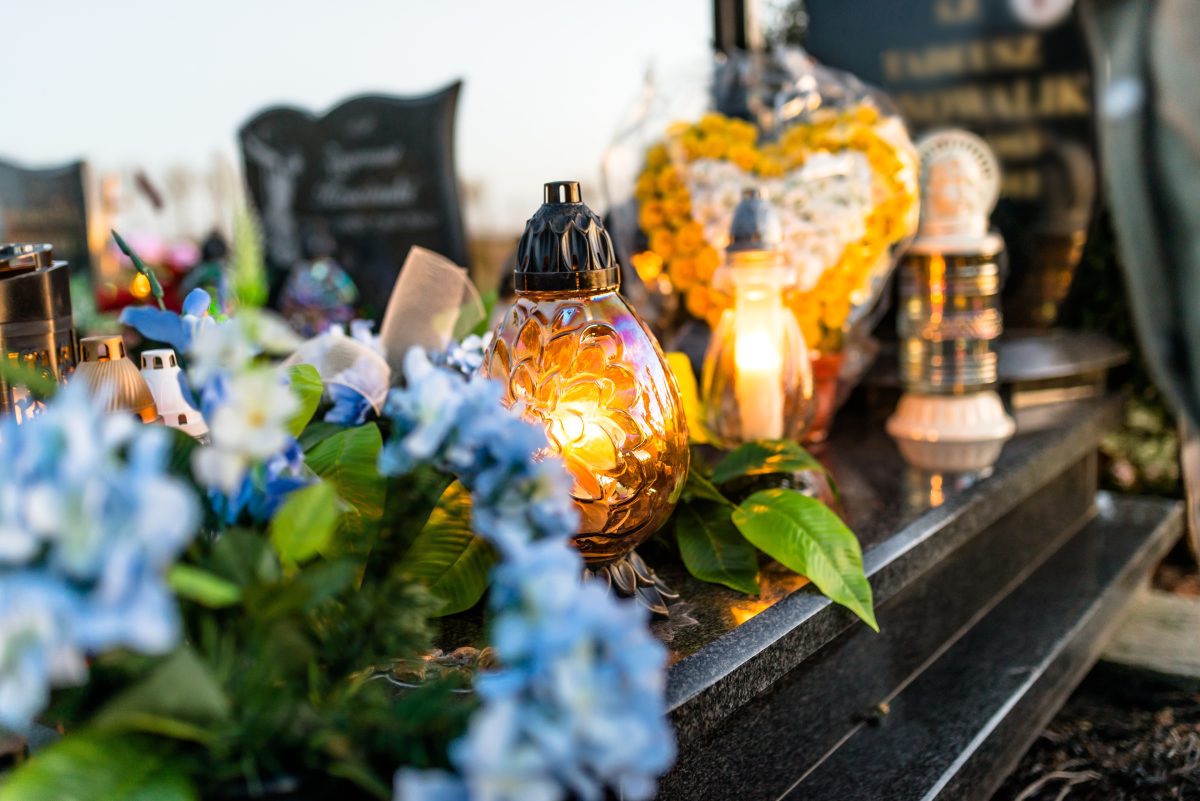 Coffin decorated with flowers and trinkets