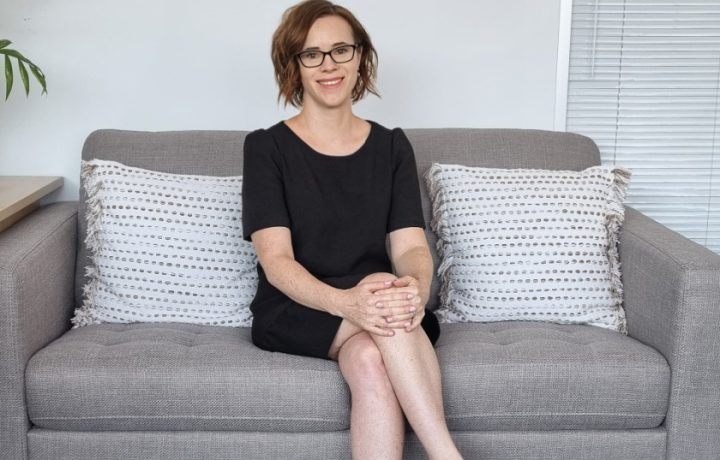 woman sitting on lounge