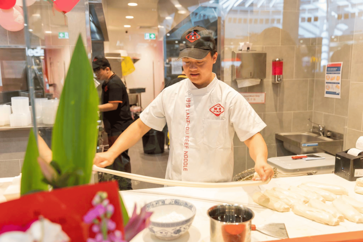 Chef hand-pulling noodles.