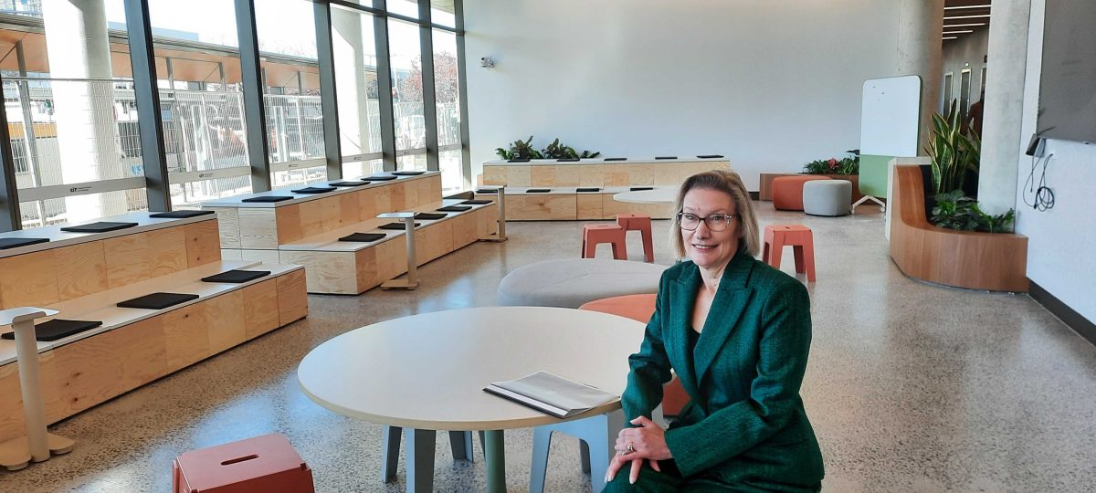 woman sitting in TAFE cafe