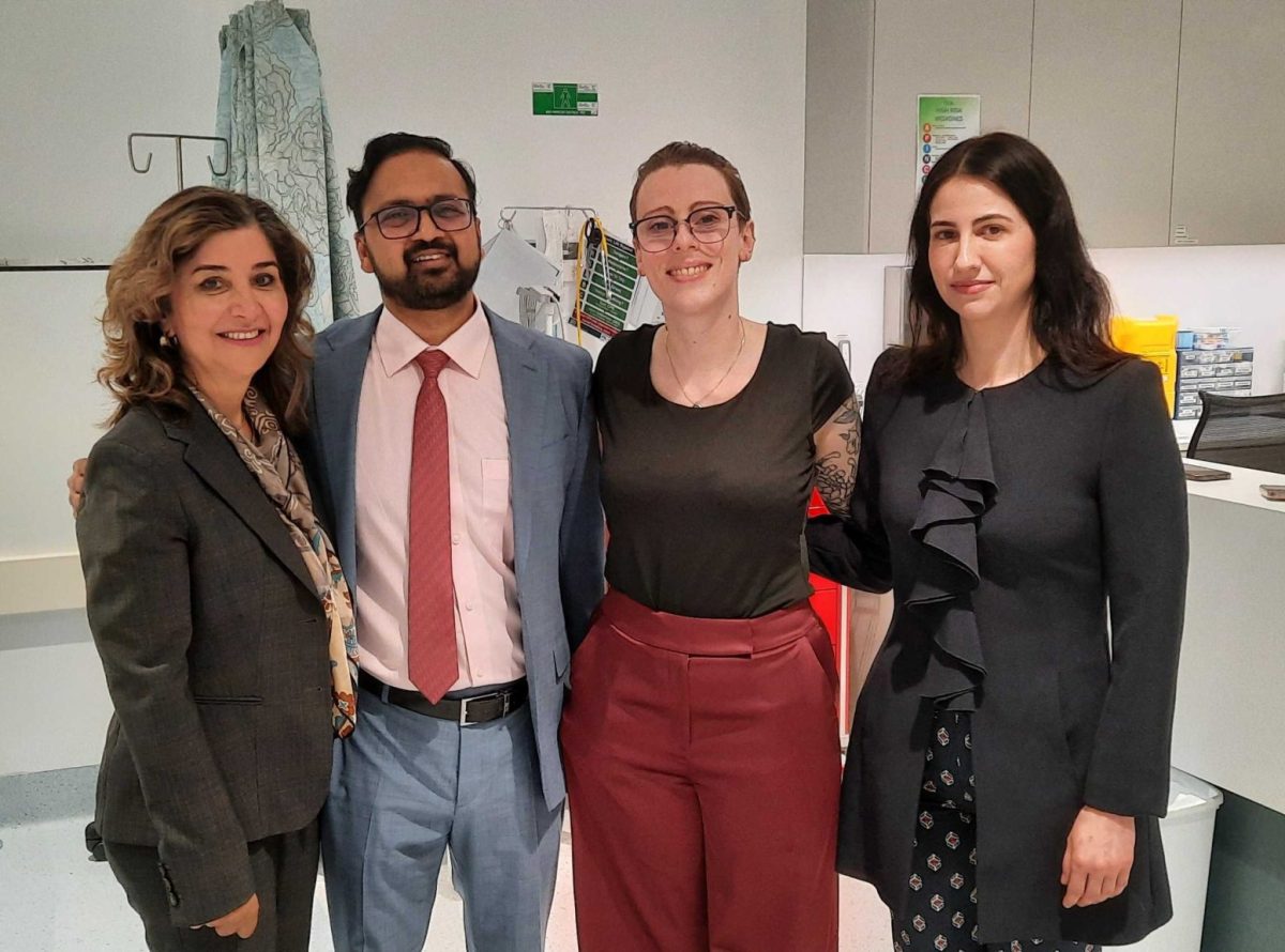 a healthcare management team of four in a hospital ward
