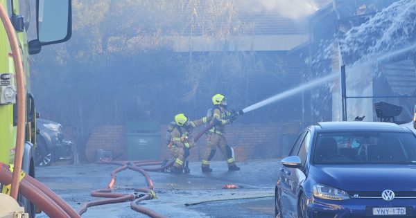 'There's like fire all on the floor of the garage here': fire brings down roof of Fyshwick business