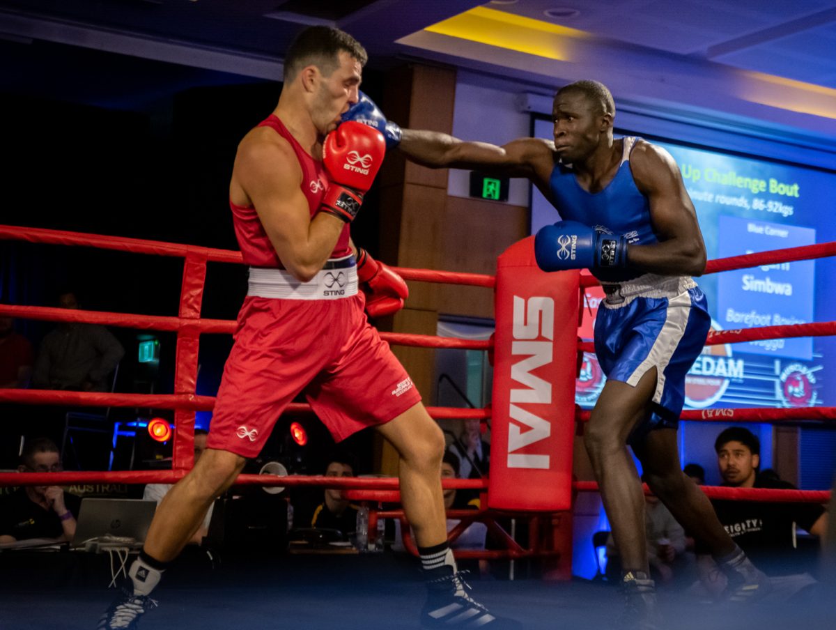 Two men boxing.