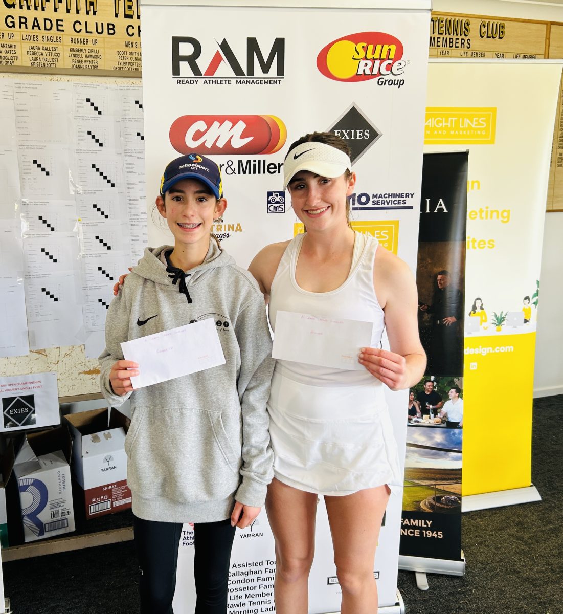 two girl tennis players on podium