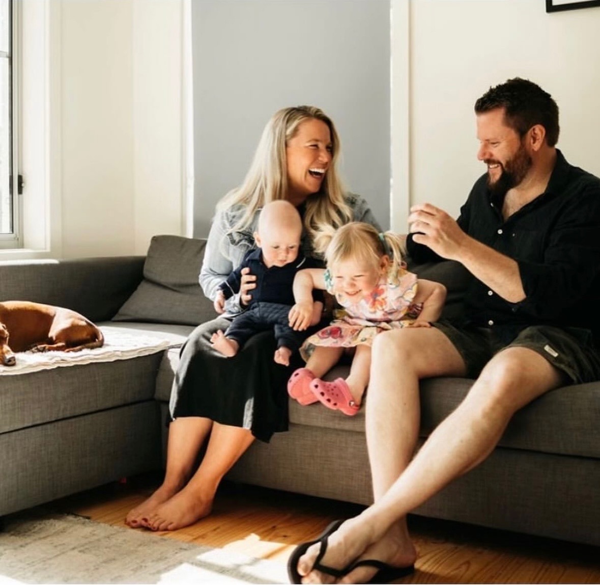 Kogelman family sitting on a couch together