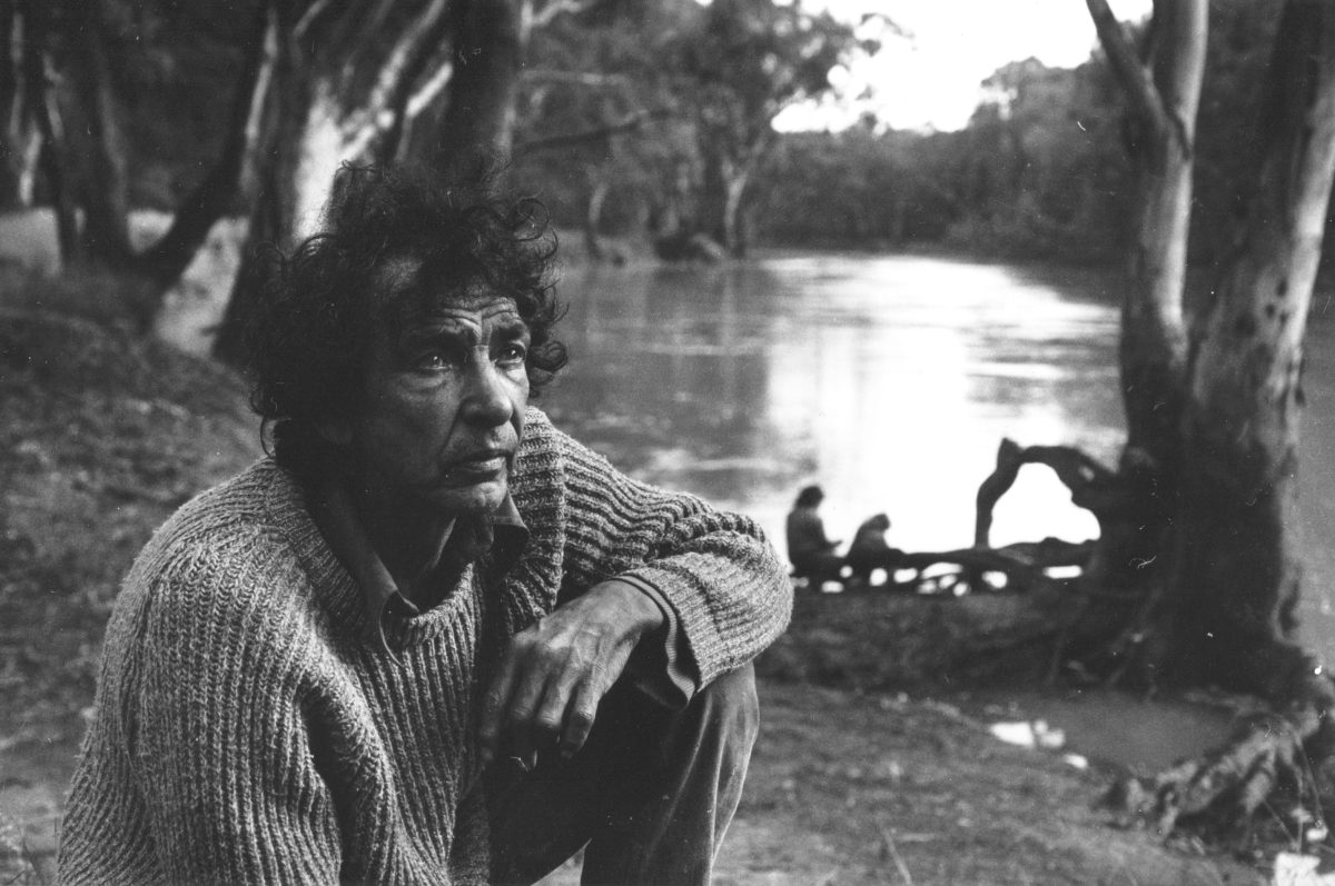 Photo of a man near a river