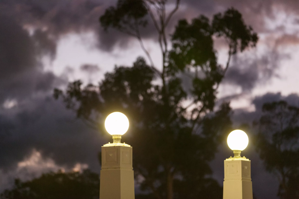 Lights above a gate at night
