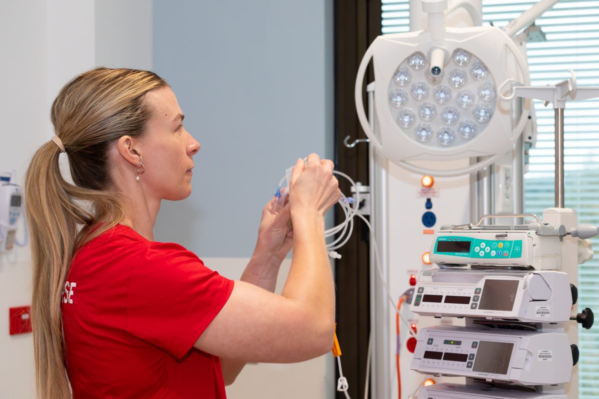 Nurse setting up a drip