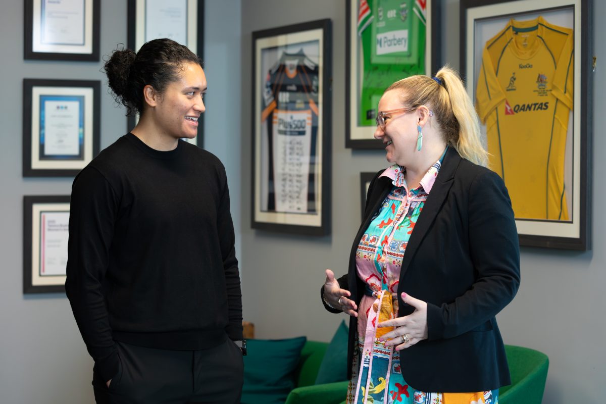 Two women talking in office