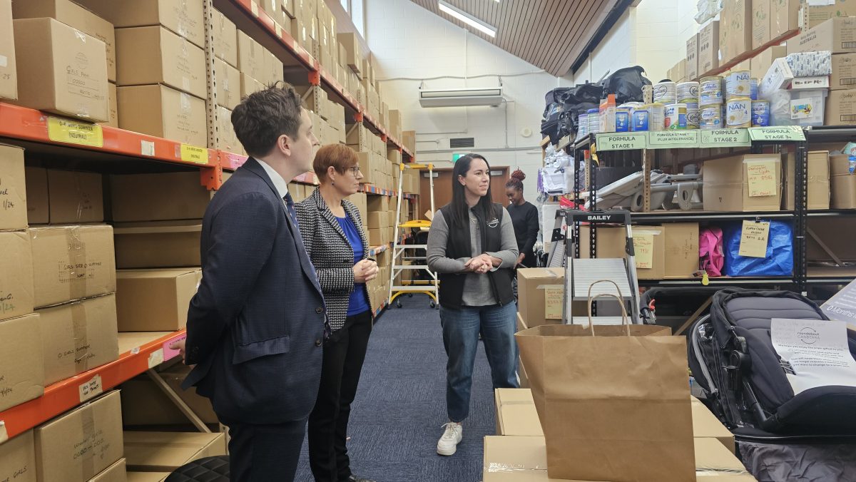 Hannah Andrevski standing with ministers Michael Petterson and Rachel Stephen Smith. Photo Nicholas Ward