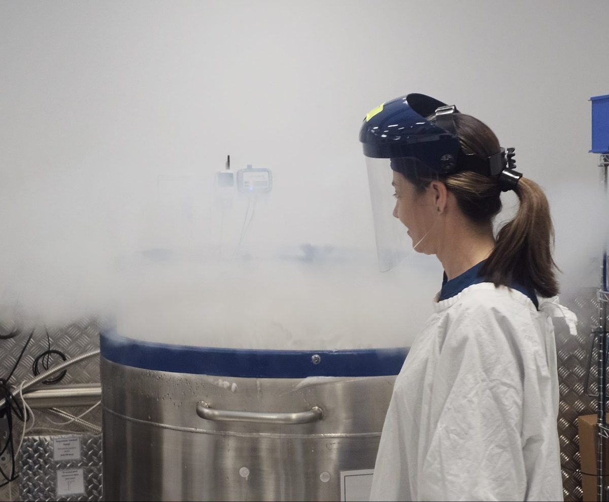 Loretta Huckstepp closes a vat of liquid nitrogen