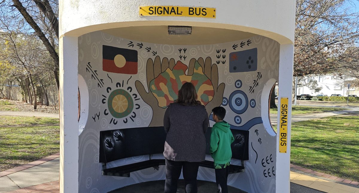 Suzanne Orr is shown new artwork by Year 6 Noah Young