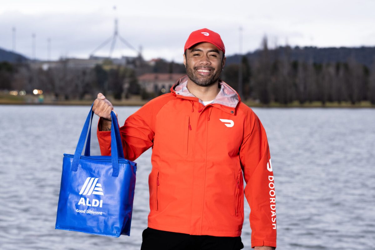 Man with ALDI grocery bag
