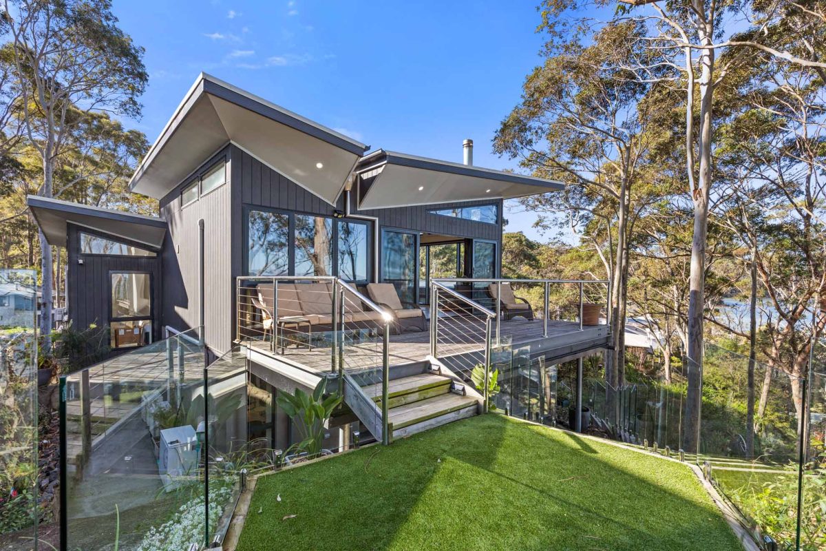 top level deck with stairs leading to lush turf