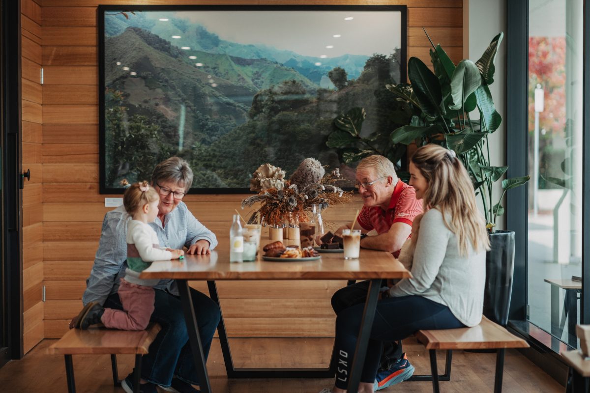 Family has coffee in a cafe