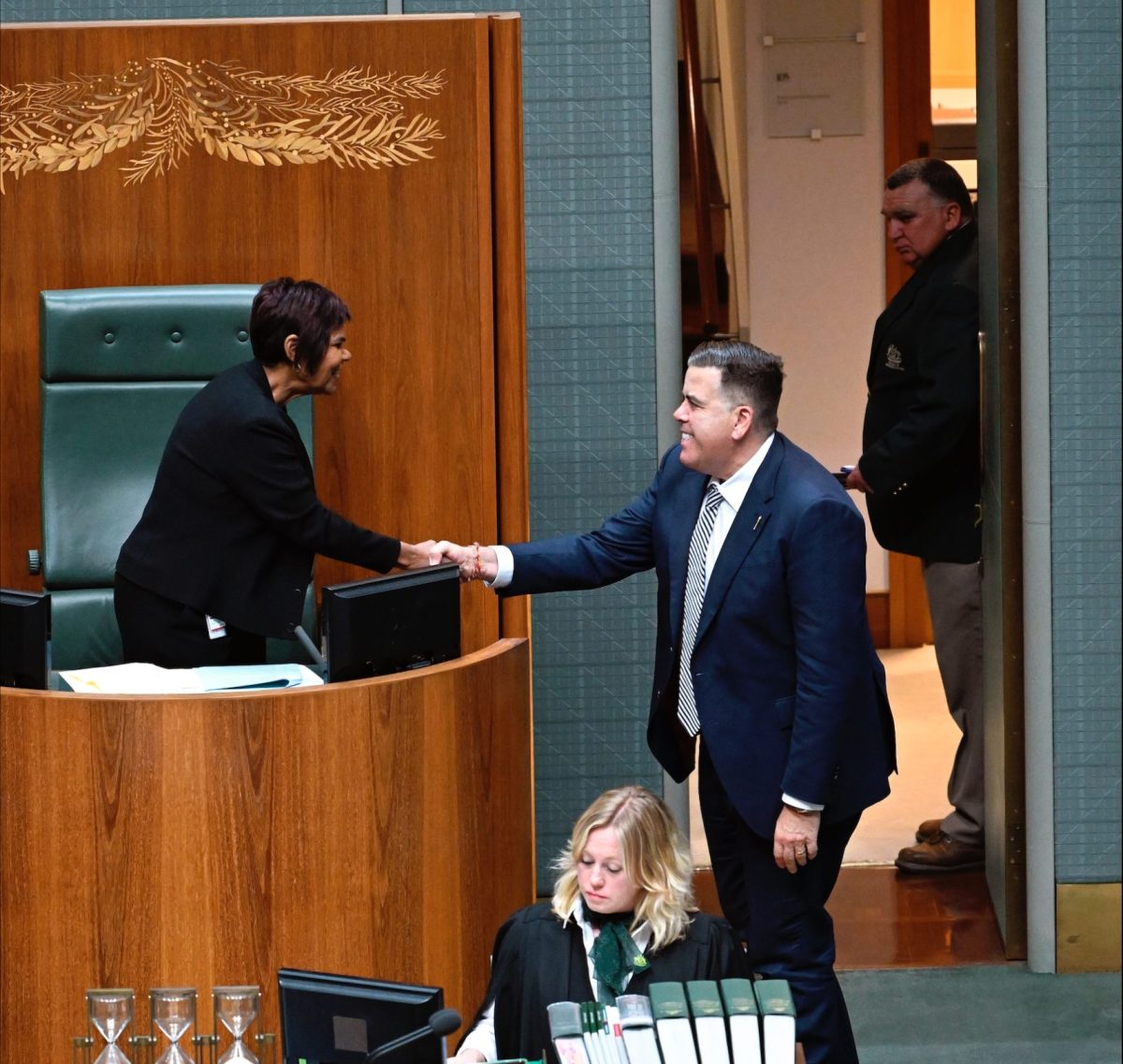 woman and man shaking hands