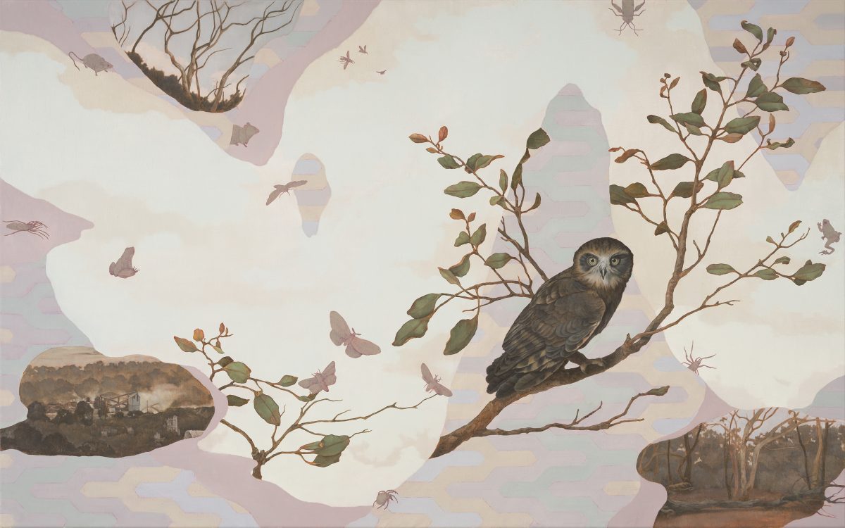 An owl on a branch in a landscape