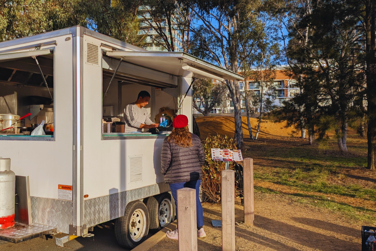 Person standing at food truck.