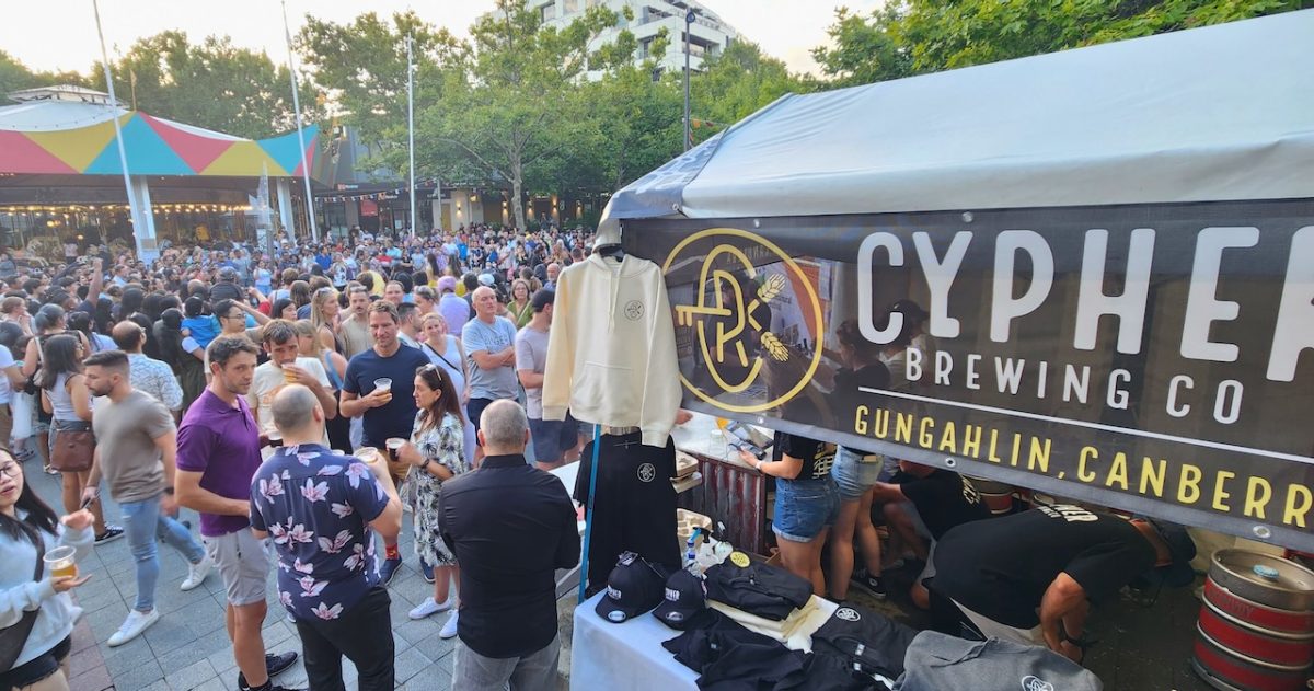 Cypher Beer tent at a festival full of people