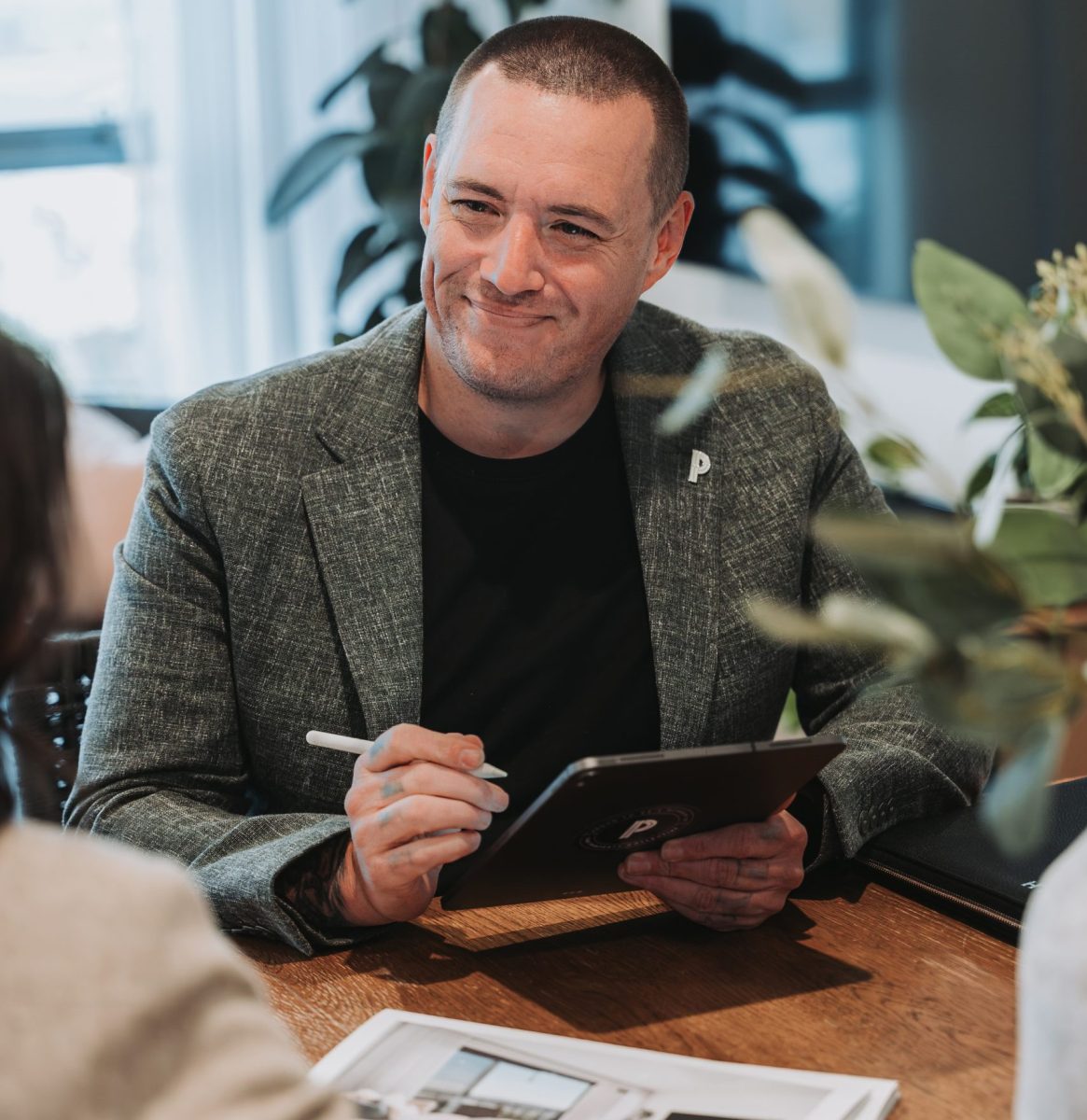 Dan Hawcroft smiling at desk