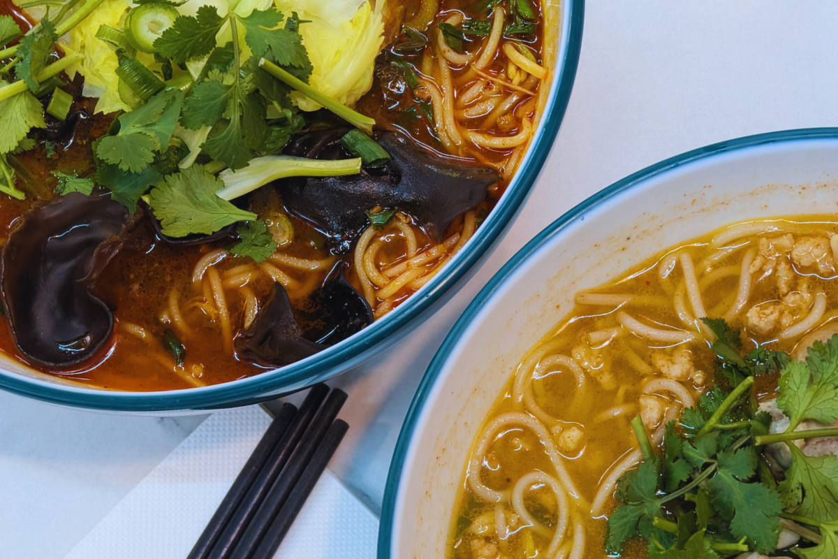 Two bowls of spicy soup.