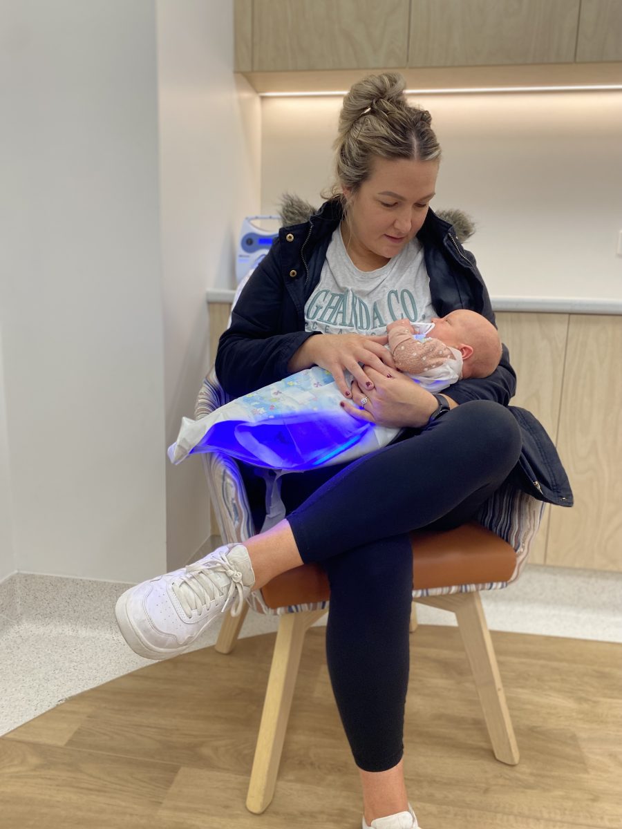 mother holding her baby in a BiliCocoon