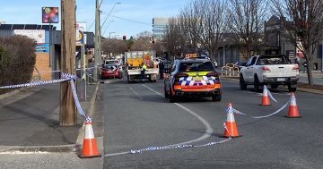 Police raid ACT, NSW homes after double stabbing in Queanbeyan