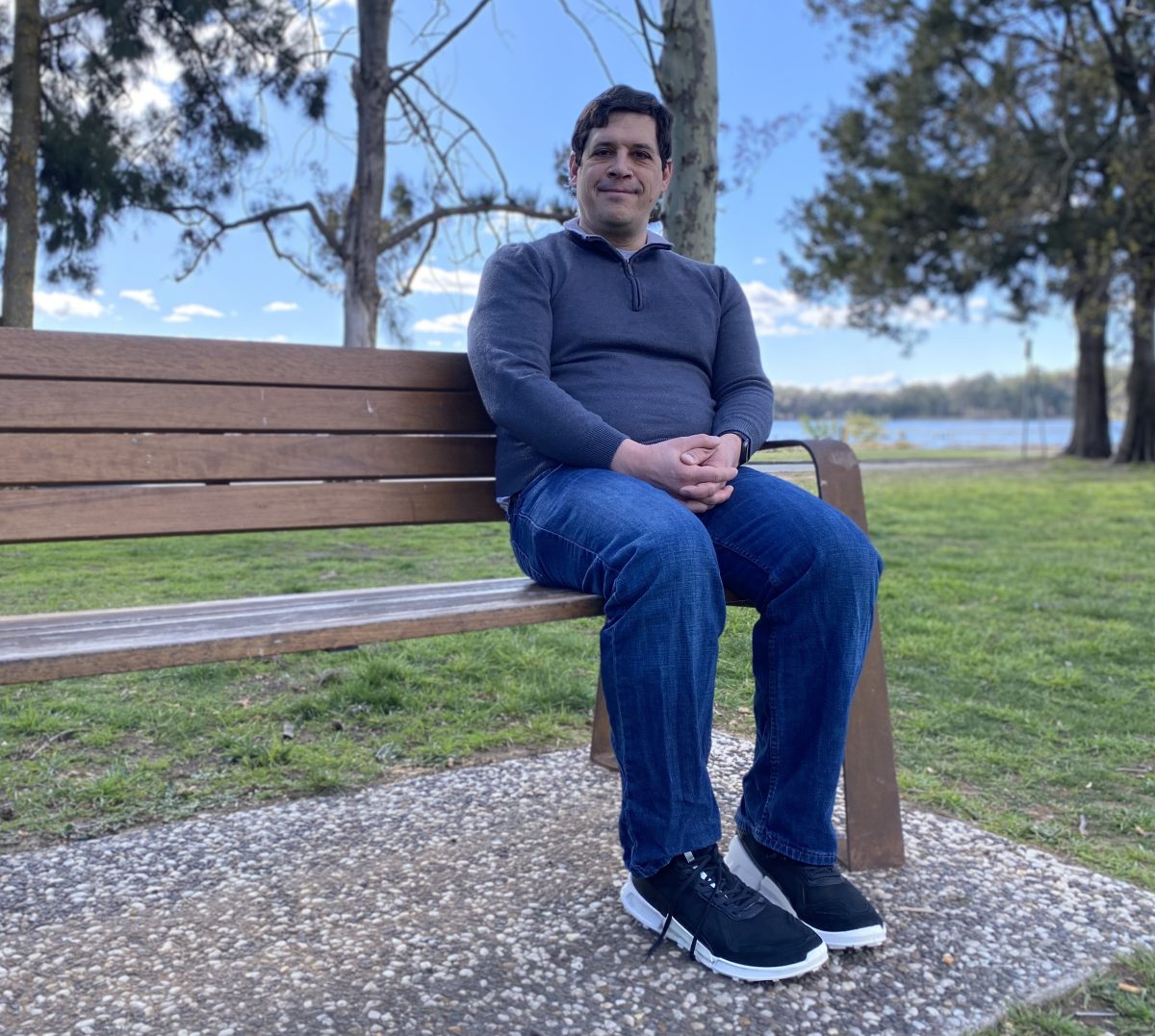 man sitting on a park bench