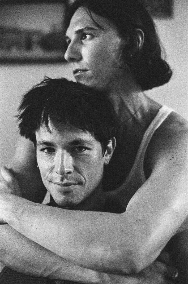 Black-and-white photo of two men embracing