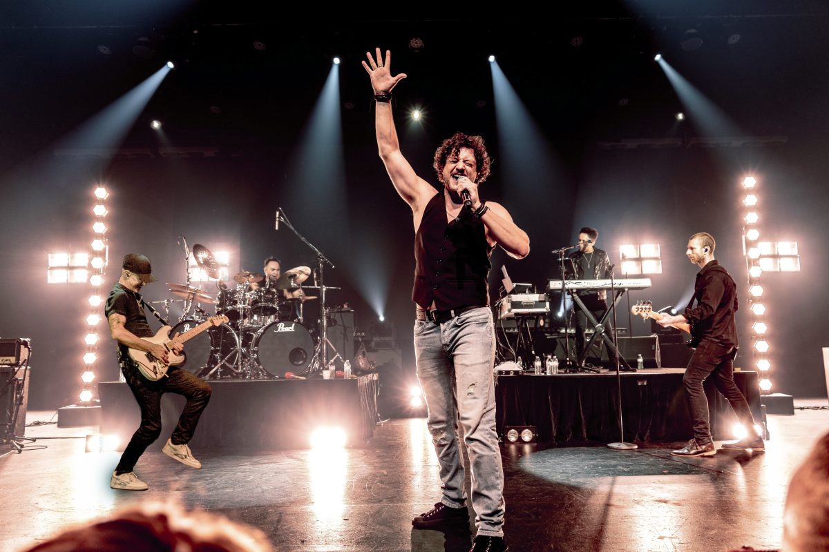 Rob Mills performs on stage