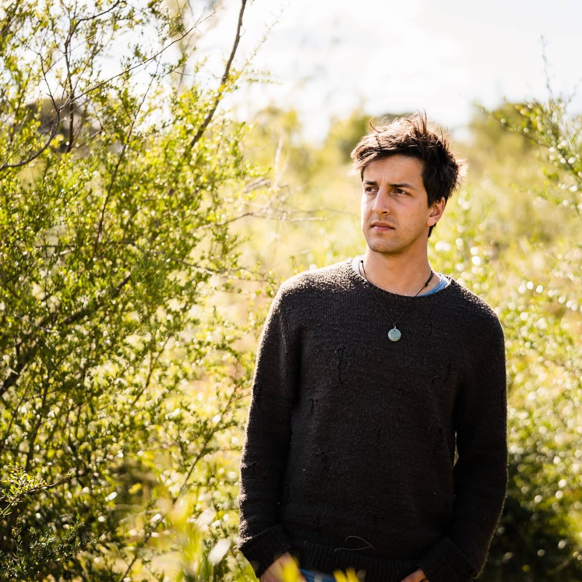 man standing in the bush