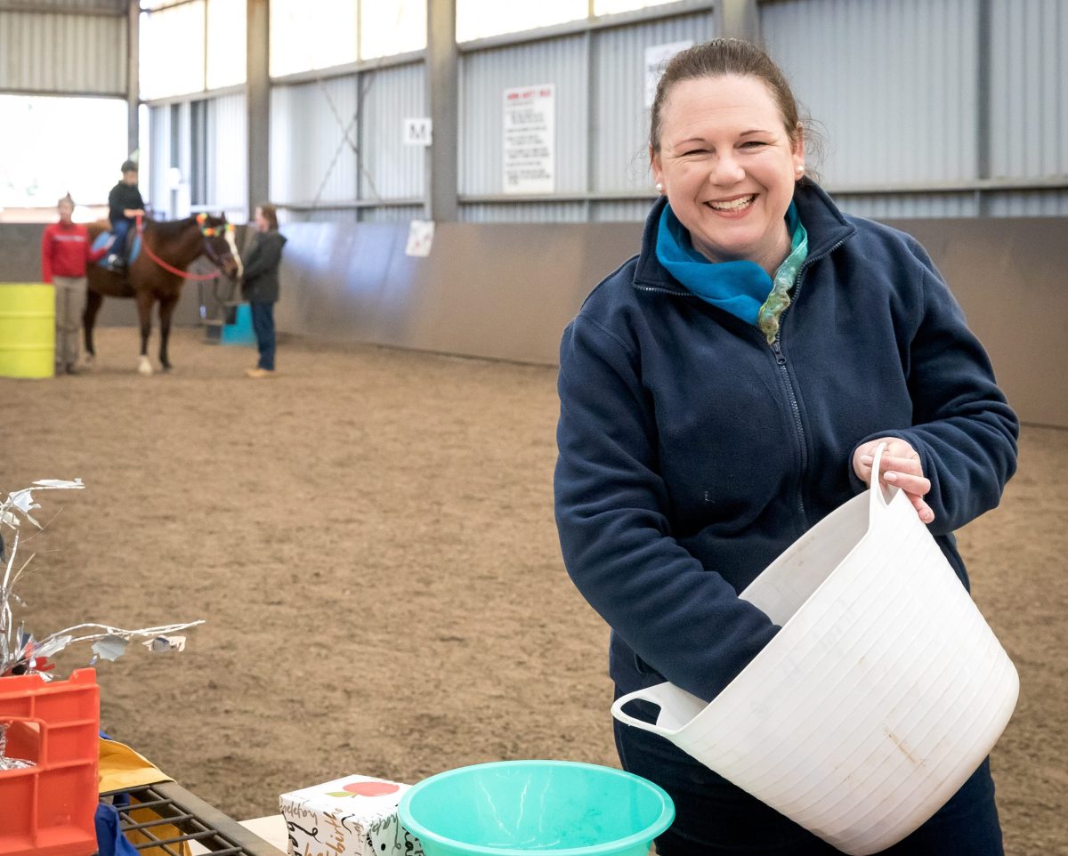 women with a hand in a bucket