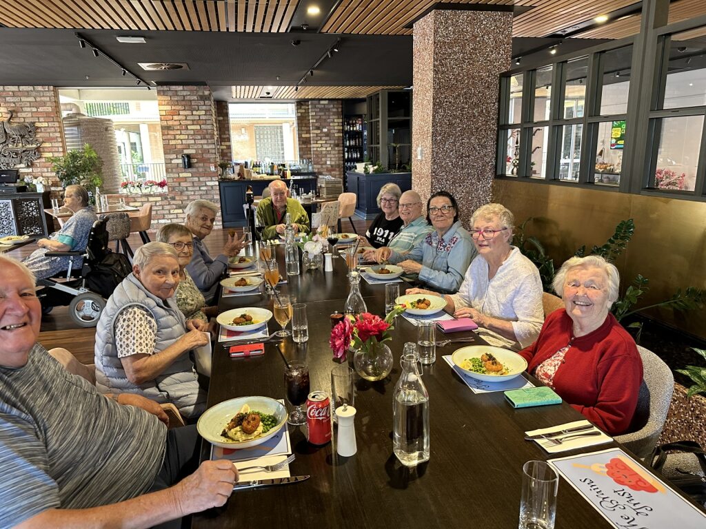 a table of people dining inside a restaurant