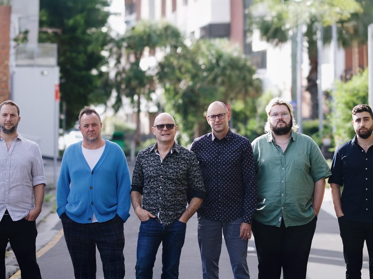 band standing outdoors