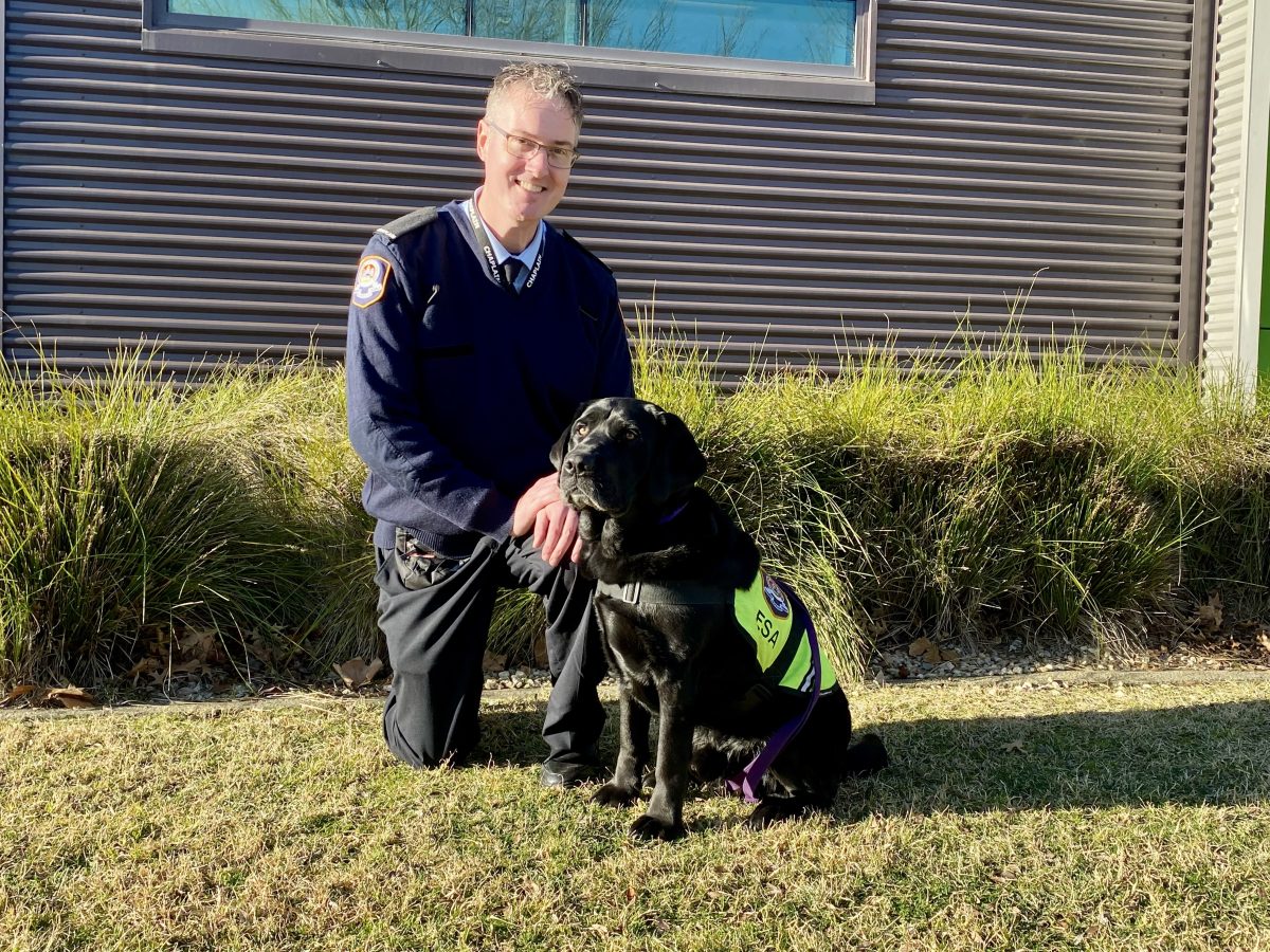 Chris Dudfield and Lachie the black Labrador