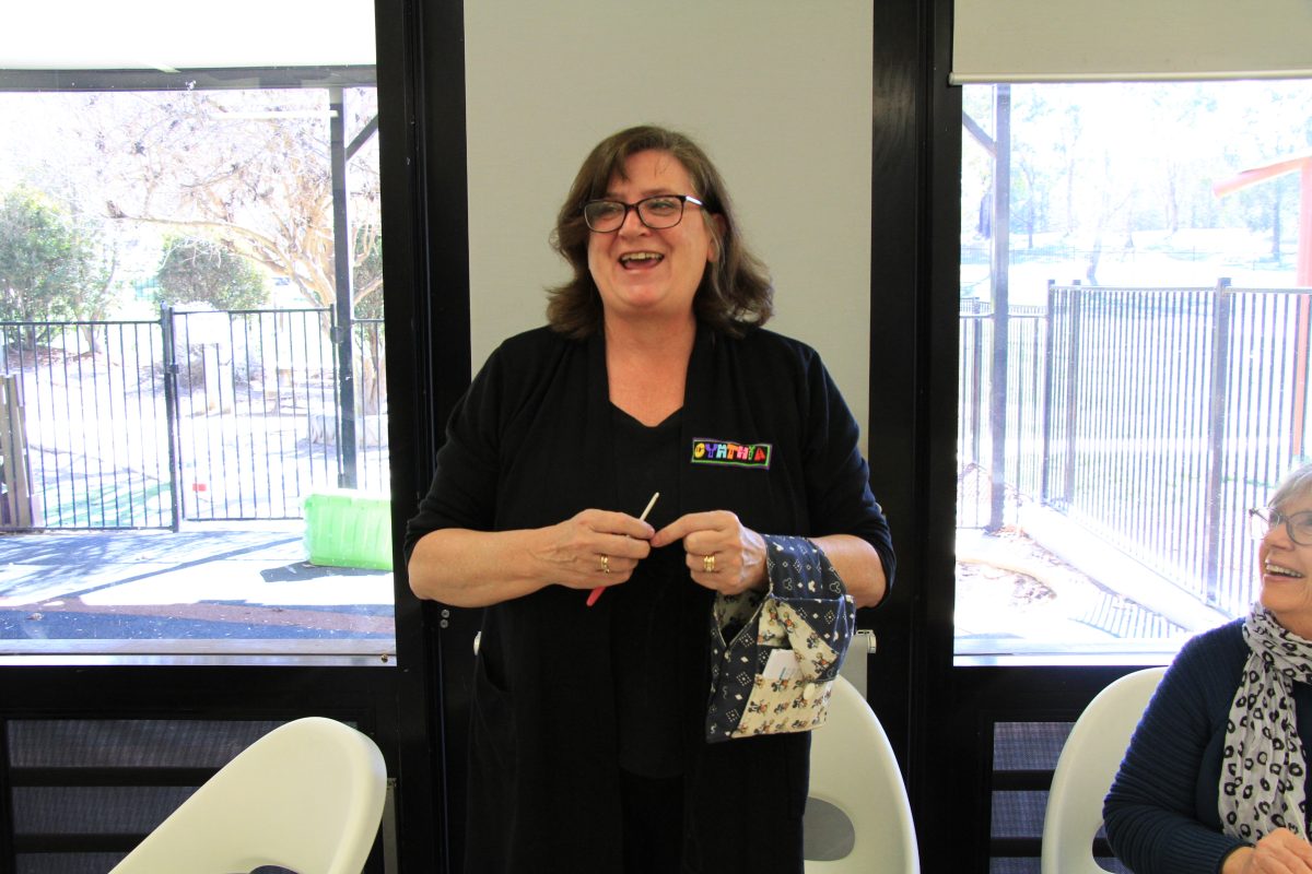 Knitter with a handmade travel knitting bag