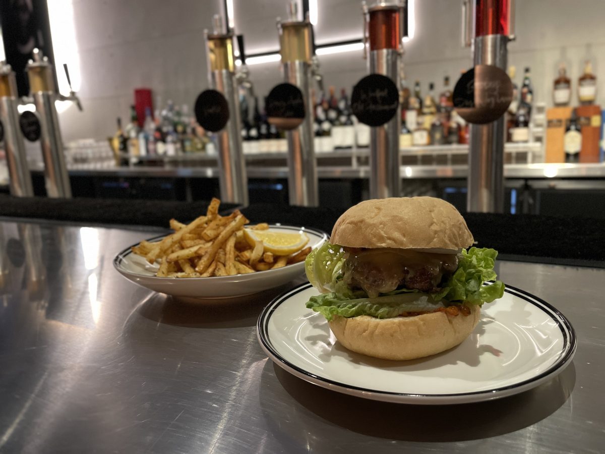A burger and plate of fries.