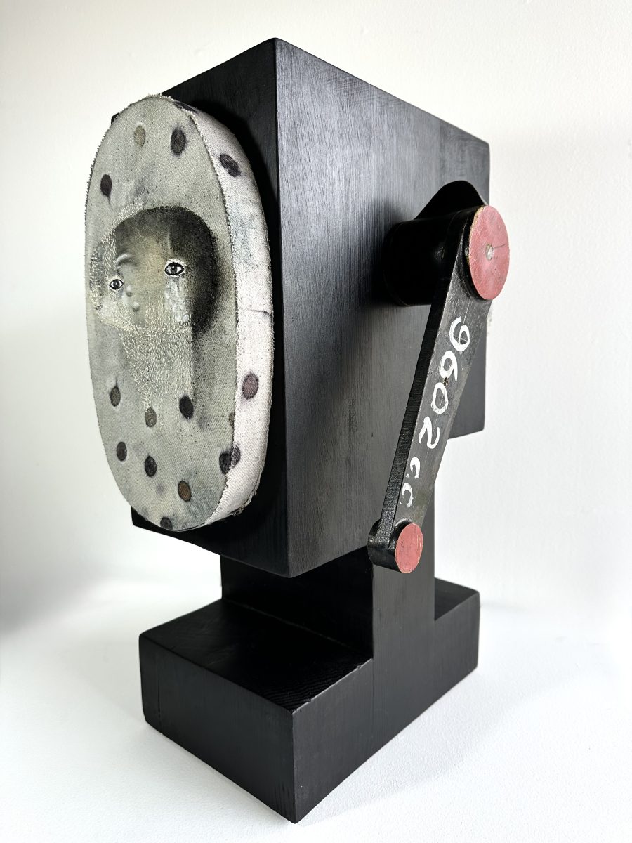 Weird phone-like contraption with a face
