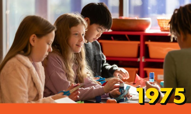 Children working on arts and crafts with the National Library's 1975 exhibition branding