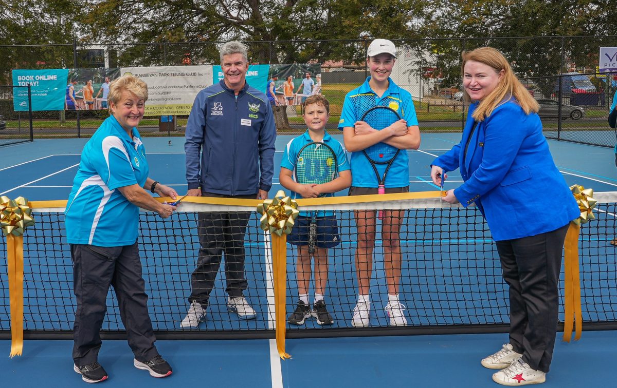 people on a pickleball court 