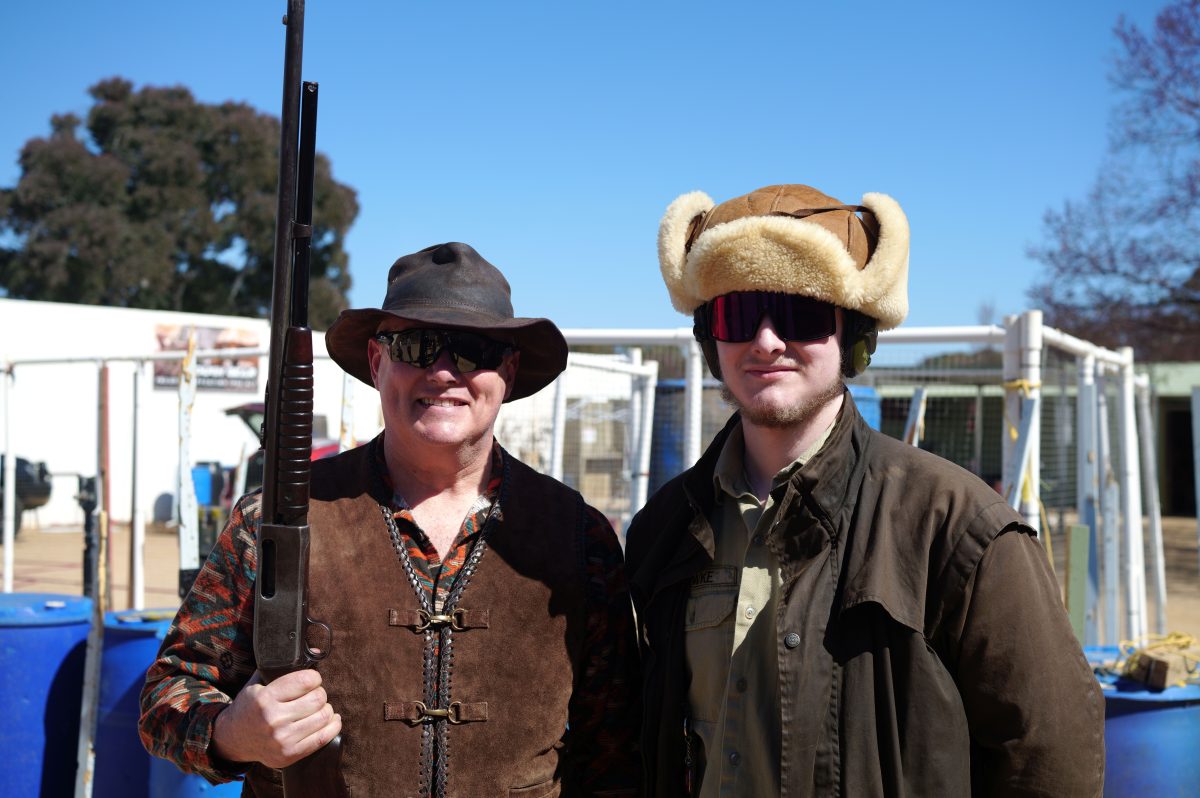 Jason "Hawkeye Delgado" Hawk carrying his great-grandfathers rifle is introducing his son Jameson to the sport.