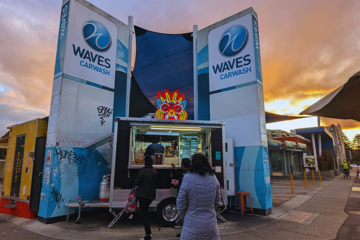 Food truck parked at car wash.