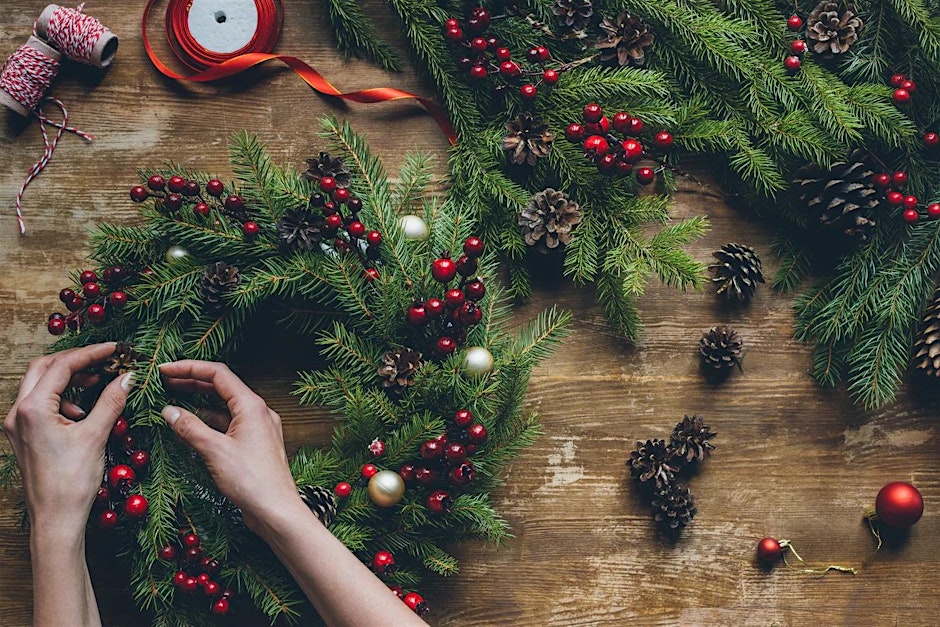 hands making a Christmas wreath