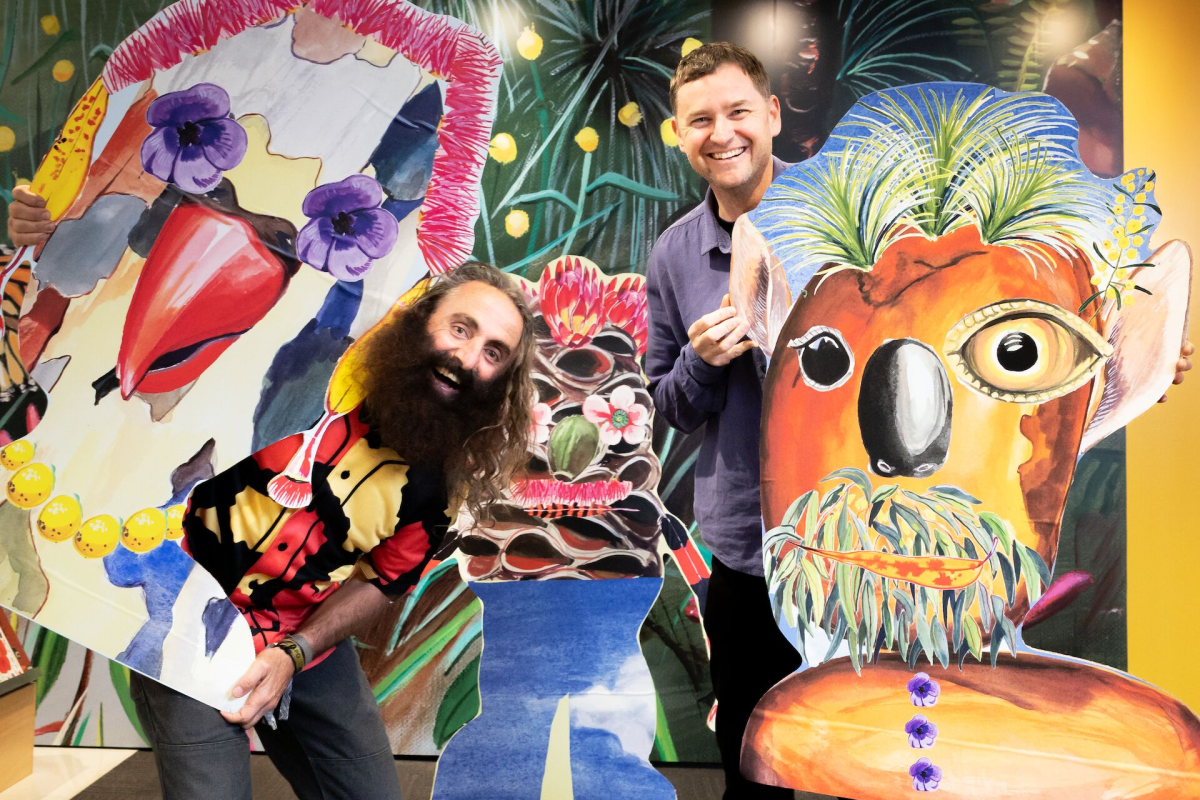 Costa Georgiadis and Rob McHaffie holding artworks